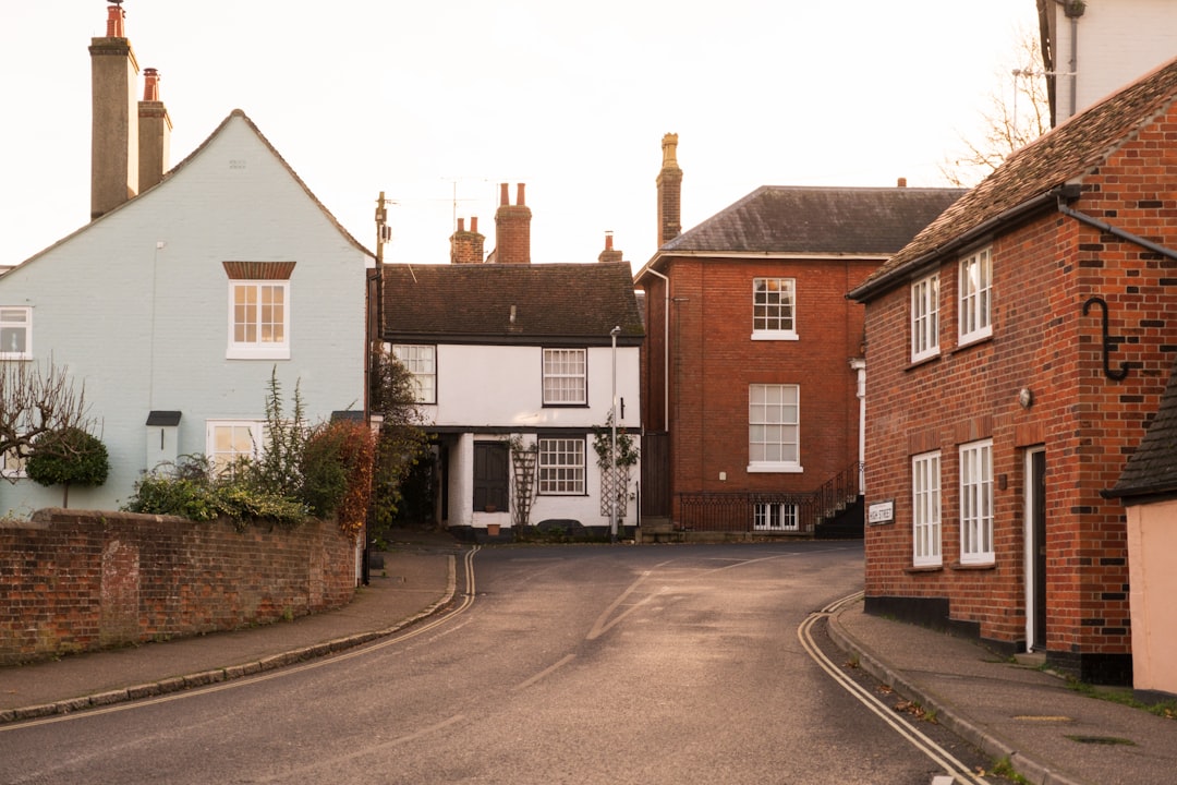 a-street-with-houses-and-a-truck-parked-on-the-side-of-the-road-bwgl-zrcjjm